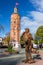 Metal sculpture of violinist and old fire tower in Vinnytsia, Ukraine