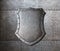 Metal shield over armor plates background
