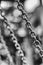 Metal shiny chain links stylized black and white film