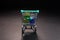 Metal shopping cart full of colorful gifts, isolated on dark, sale, discount, black Friday concept