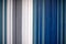 Metal siding in blue, white, grey colors