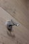 Metal silver hook for bathroom, kitchen. A hook for towels, clothes, and other personal items
