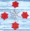 Metal snow flake and four red snow flakes Christmas on a white a