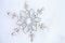 Metal snow flake in snow Christmas decoration