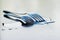 Metal spoon and fork on a large water drop on a clean surface