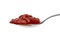 Metal spoon with red sambal, Indonesian chilli sauce, on white background