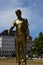 Metal statue to the common caritative helper in MARIENHOF square in Munich, Germany