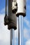 metal steel hydraulic piston to working excavator on a blue sky background.