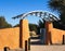 Metal and stone gate in nature preserve.