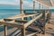 Metal structures on the shoreline for shelter from the sun. View of the sea line and the horizon. Geometric metal structures