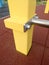 Metal swedish ladder with yellow beams on playground