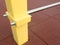 Metal swedish ladder with yellow beams on playground