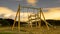 Metal swings on a wooden structure, night photos