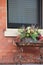 Metal table with Fall arrangement set on old porch