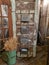 Metal Tin Decorative Containers Against And Old Door In A Barn