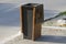 Metal trash can with wooden elements