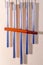 Metal tubular bells with a bamboo tube hang on the wall and create the music of the wind