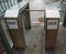 Metal Turnstile with inscription EXIT or urban Checkpoint close-up