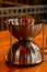 Metal vessel for wine tasting spittoon shaped hourglass vertical photo