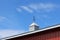 Metal weathervane decorates the roof