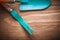 Metal weeding scoop hand spade on wood board agriculture concept