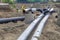 Metal workers install new pipeline heating system