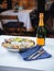 Metallic bowl with fresh appetizing oysters with ice and lemon with champagne