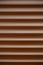 Metallic brown blinds. Abstract pattern lines waves