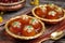 Metallic charm Indian dessert Gulab Jamun in a traditional bowl