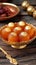 Metallic charm Indian dessert Gulab Jamun in a traditional bowl