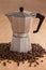 Metallic coffee maker with coffee beans