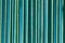 Metallic fence painted with green paint as a background