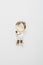 Metallic golden brooch in shape of male doctor with stethoscope, pin broach on white background. Bijouterie, jewelry for medical