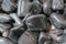 metallic gray tumbled hematite gemstone as mineral rock