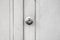 Metallic knob on white wood door , stainless steel round ball door knob