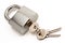 Metallic padlock with three keys in keyhole