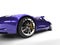 Metallic purple modern luxury sports car - front wheel closeup shot