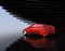 Metallic red autonomous car on abstract background
