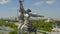 Metallic sculpture monument of Worker and female Collective farmer Rabochiy i Kolkhoznitsa on museum pavilion roof. Europe