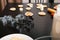 Metallic shapes for cutting gingerbread cookies are prepared on a black table.