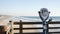 Metallic stationary observation tower viewer binoculars California pier USA. Coin operated telescope