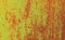 Metallic wall background, texture, colored in fiery yellow color