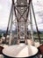 Metallic white iron construction of pipes, the mechanism of the Ferris wheel is not against the backdrop of the mountains. Inside