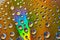 Metallic yellow with silver rainbow bubbles and brilliant burst of light across abstract surface