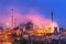 Metallurgical plant with white smoke at night. Steel factory with smokestacks . Steelworks, iron works. Heavy industry