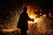 Metallurgist steelmaker takes a sample of liquid metal from a ladle