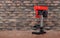 Metalwork tool - Red new drill press brick wall background