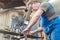 Metalworker man in his workshop working on project