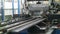 Metalworking machine forming metal sheet at plant. Production domestic appliances