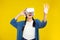 Metaverse Concepts, Asian woman in vr glasses isolated yellow background, playing video games with virtual reality headset, People